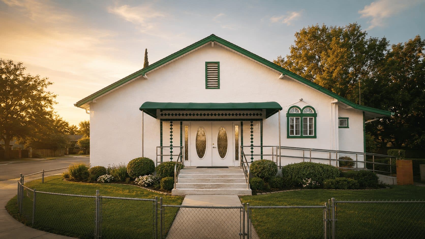 The Islamic Center of Live Oak, a white building with green trim and double front doors